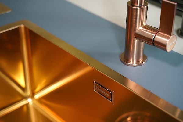 Brandy sink with satin finish paired with a satin copper mixer